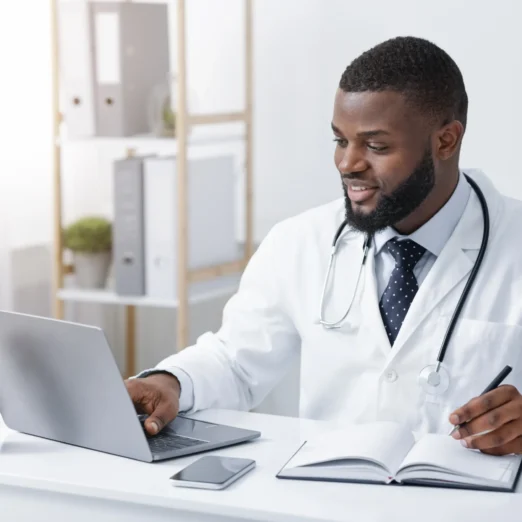 friendly-black-doctor-making-online-check-up-usin-2025-03-31-23-56-39-utc (1) (1)