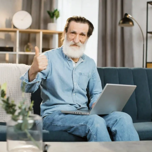 handsome-mature-gentleman-using-laptop-for-video-c-2024-12-13-13-56-22-utc (1)