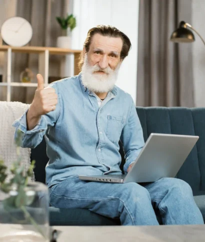 handsome-mature-gentleman-using-laptop-for-video-c-2024-12-13-13-56-22-utc